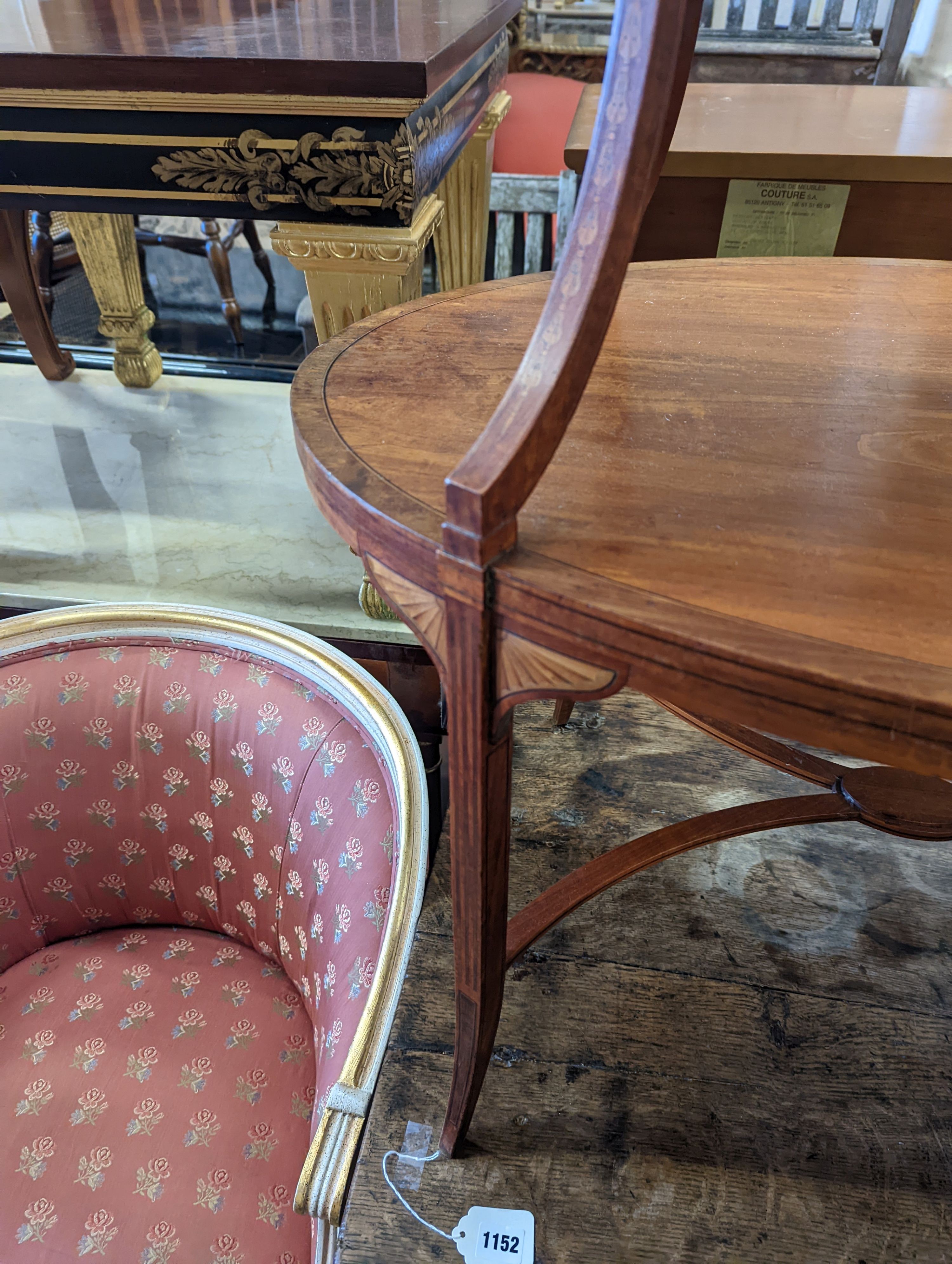 An Edwardian Sheraton revival oval inlaid satinwood two tier etagere, width 89cm, depth 55cm, height 77cm